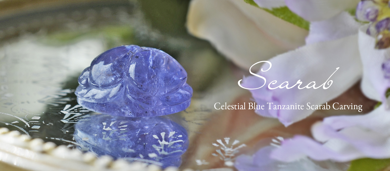 セレスチャルブルータンザナイトスカラベカービング21.97ct